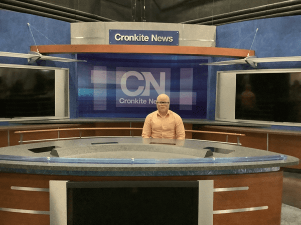 Man sitting at Cronkite News studio 