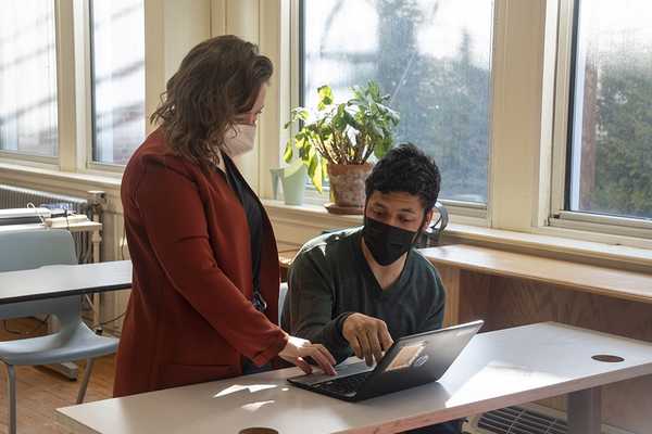 teacher and student in classroom