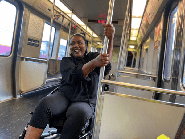 Salome riding the mass transit system in Boston.